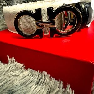 Small buckle black and chrome men’s Salvatore Ferragamo belt. Waist is 34-36”